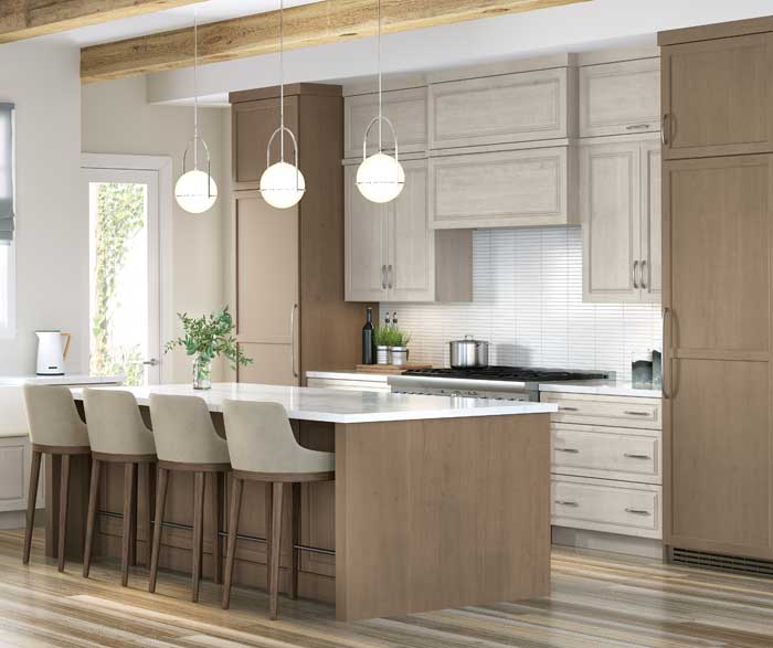 Two-tone taupe shaker kitchen with globe pendants