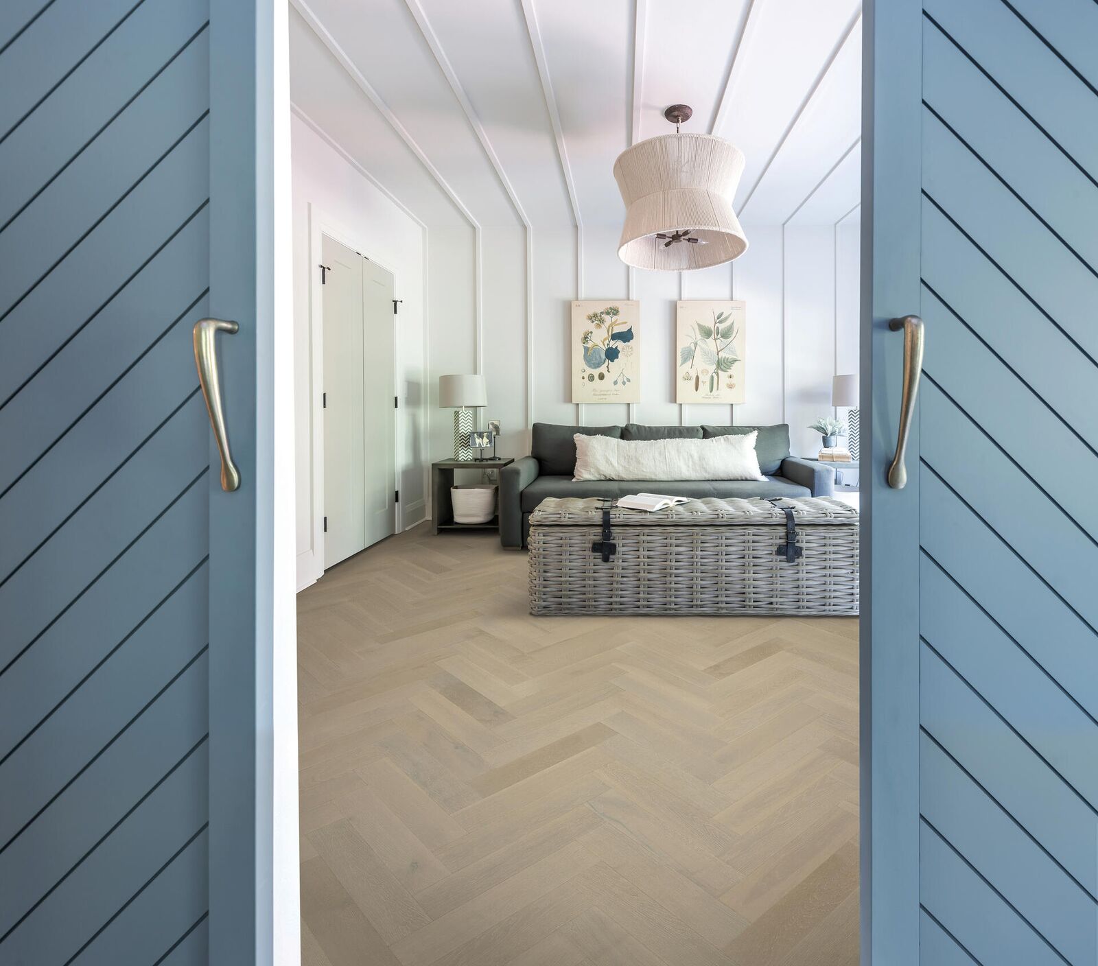 Hardwood herringbone — white oak in coastal blue-door bedroom