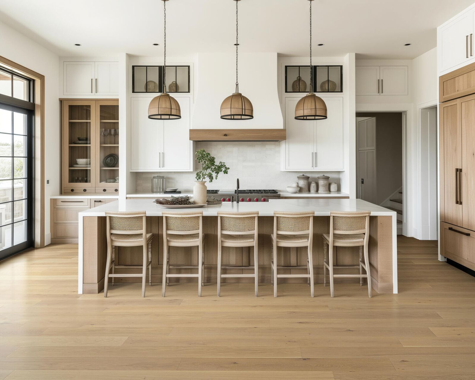 Hardwood — pale oak in bright kitchen with rattan pendants